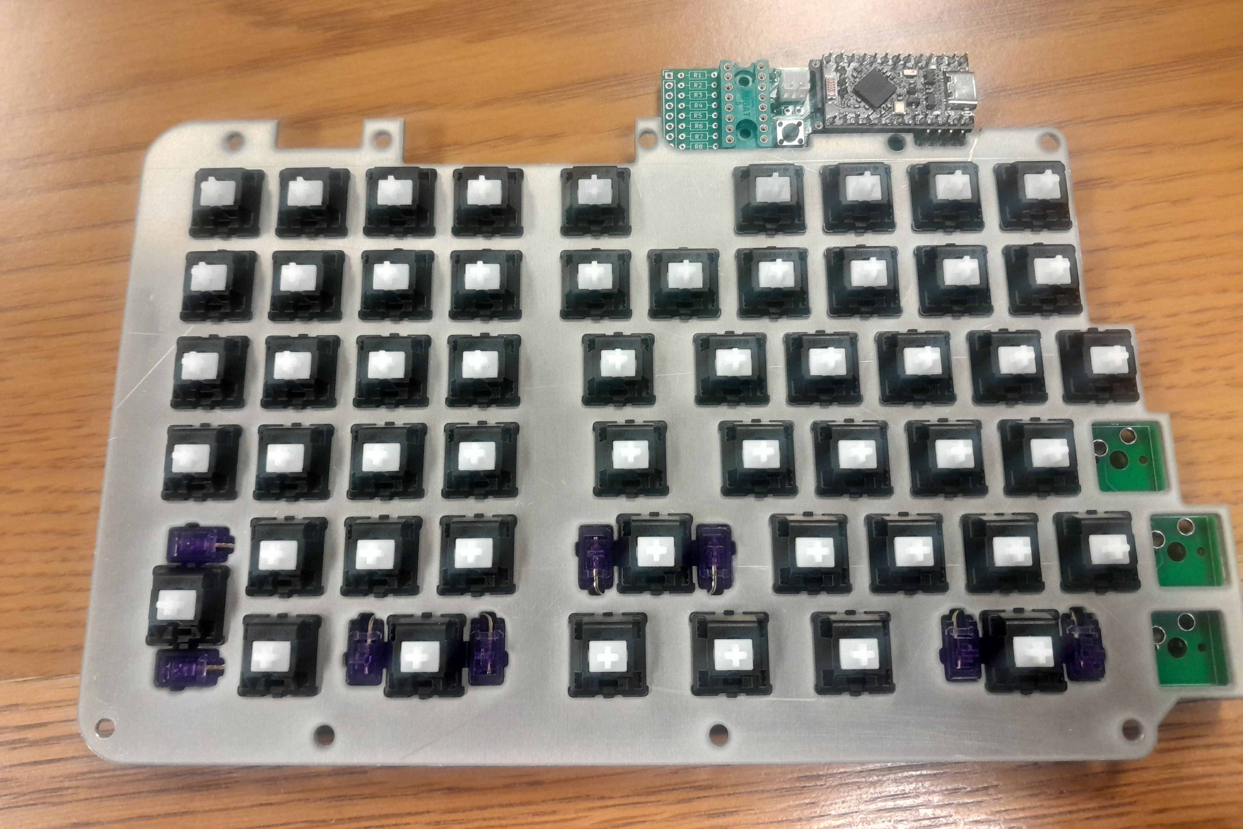 The keyboard half-assembled with switches visible